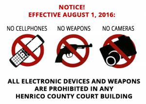 A notice states that all electronic devices and weapons are prohibited in Henrico county courts.